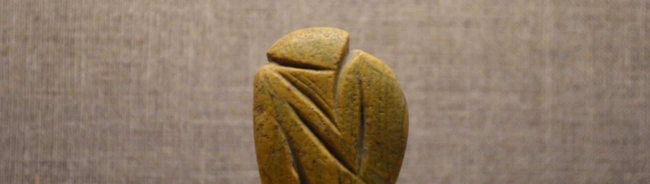 Seated sculptured pebble